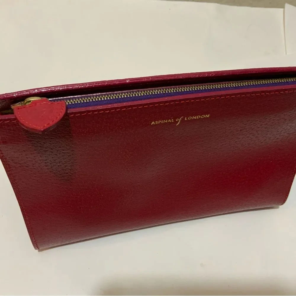 NWOT Aspinal of London red reptile cosmetic case.